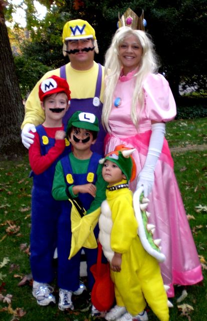Sasha Mitchell with her family as Mario Brothers characters on Halloween.