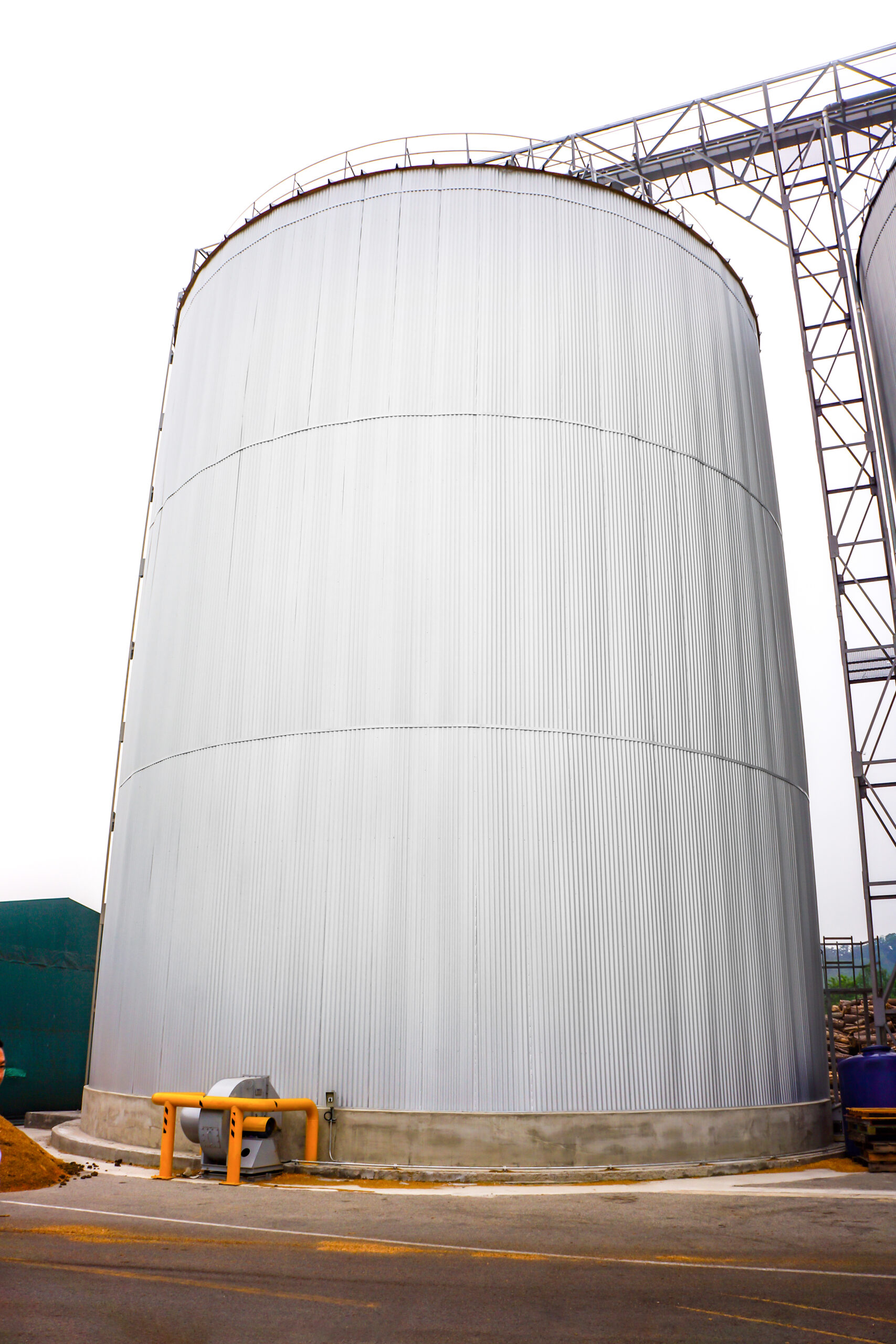 a white silo, which could contain lots of fire prone wood pellets
